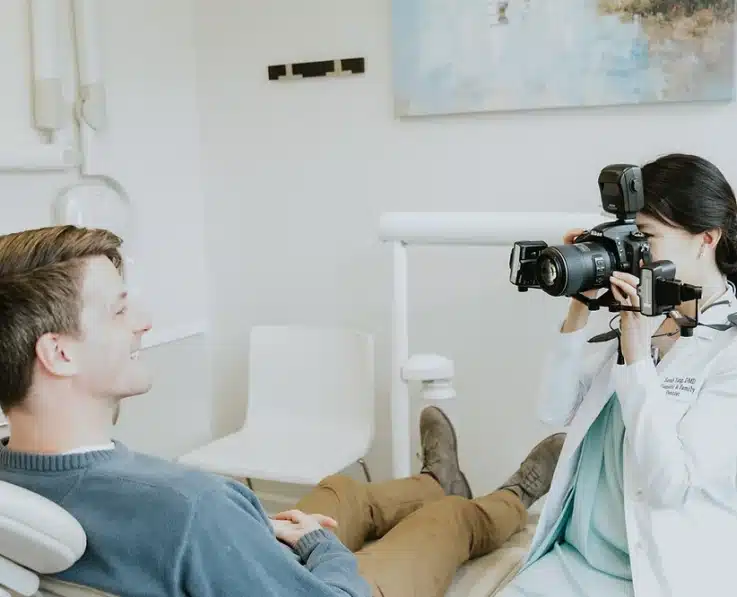 Lp Dental Dentist Taking a Picture of a Smiling Patient